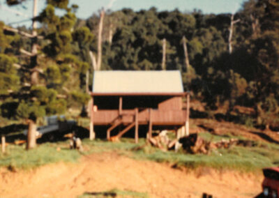 First Construction Project, Carrai-1983, by Peter Moroney Building Certifier. Timber Cabin, Motorbike, Grassy Hill, Trees,