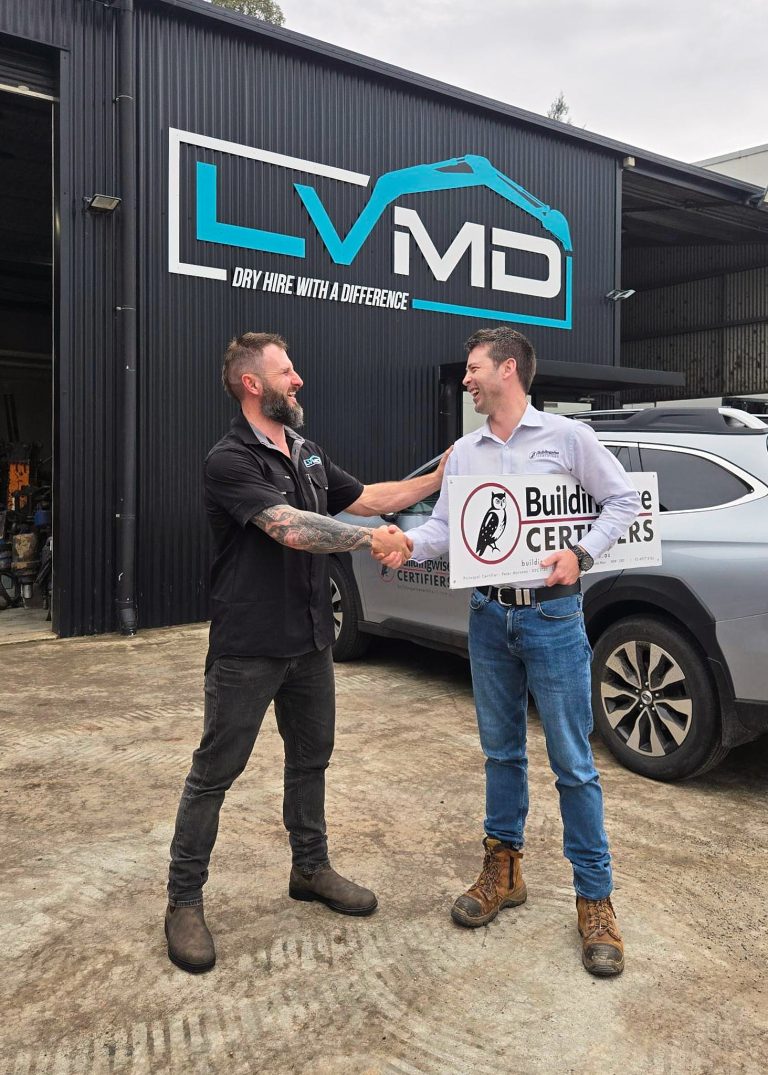 Our private certifier and the happy CUSTOMER shake hands after the construction certificate is complete and his business can power on. Both Laughing.