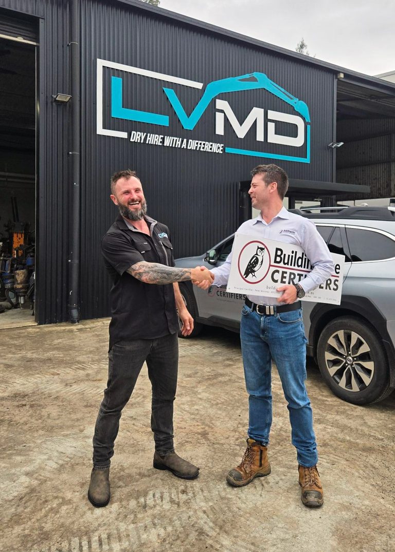 Our private certifier and the happy CUSTOMER shake hands after the construction certificate is complete and his business can power on. More Laughs.