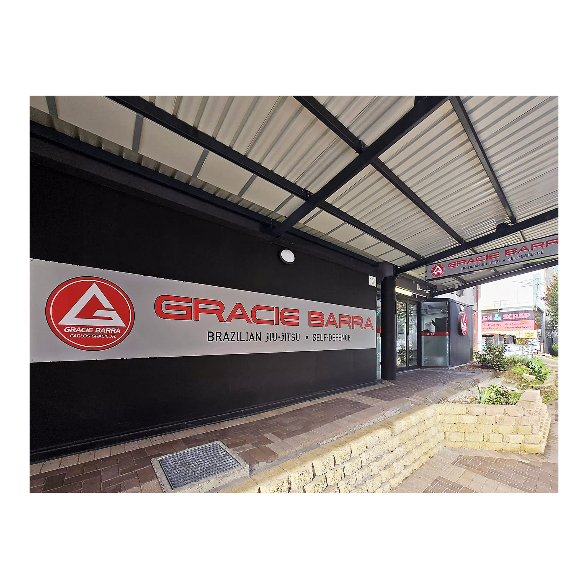 front access and footpath of Gracie Barra Charlestown after CDC private certification, showing large logo and branding