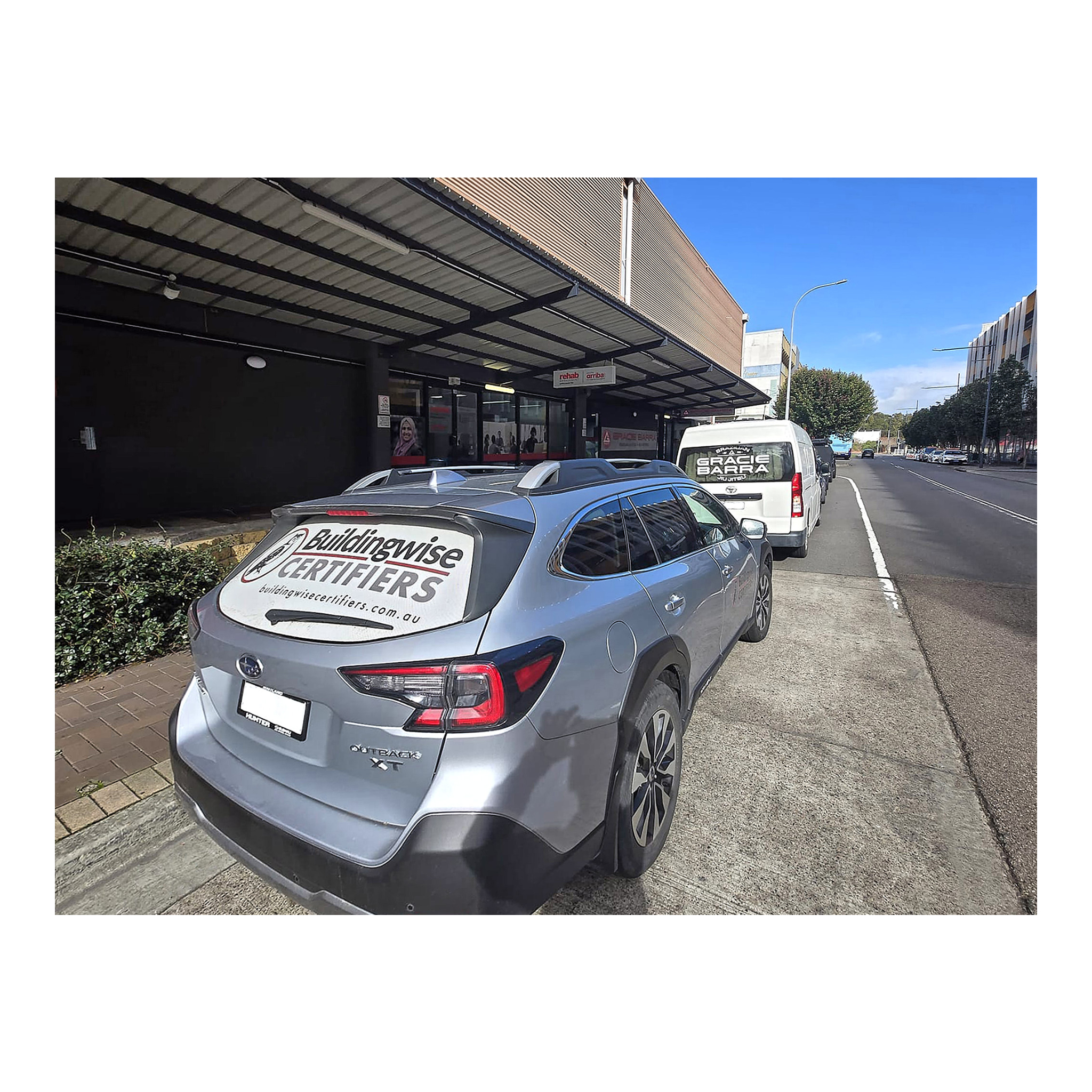 2 cars, one of Buildingwise Certifiers Private Certifier, and Gracie Barra BJJ school. 