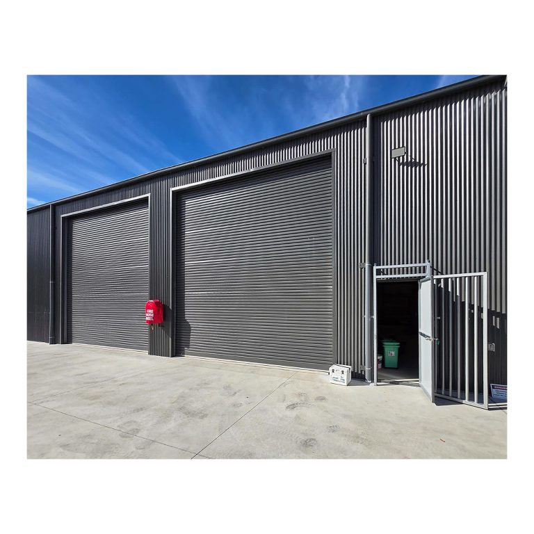 Industrial vehicle access roller doors and pedestrian entry, newly certified storage shed and workshop, Kempsey NSW