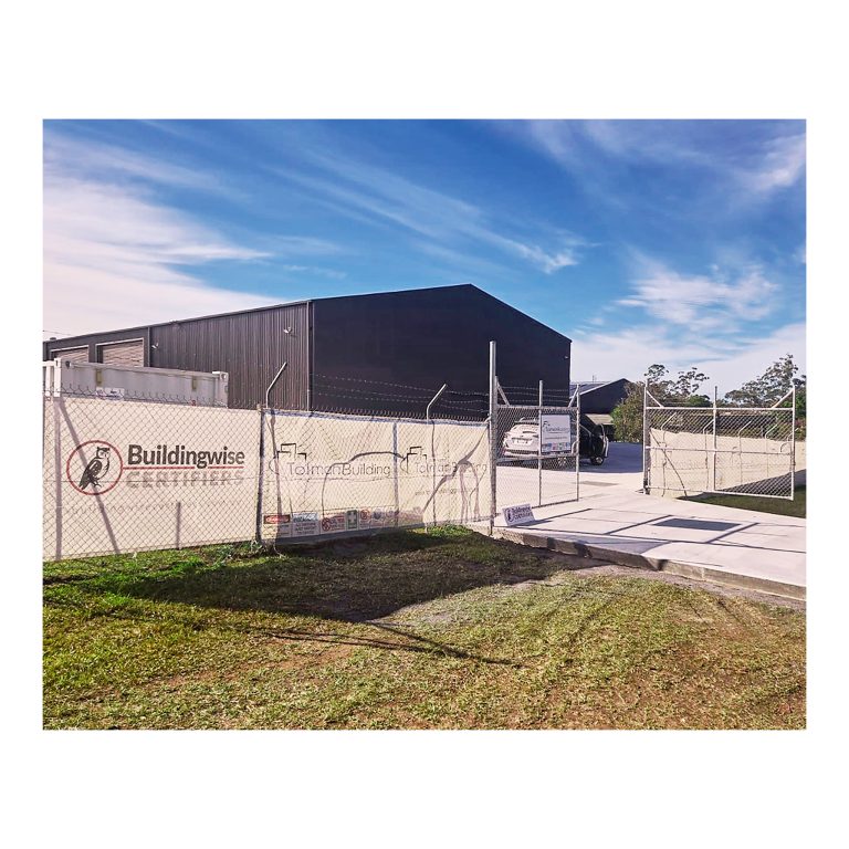 Buildingwise Certifiers and Tolman Building Group hoarding signage on construction fence, Kempsey NSW